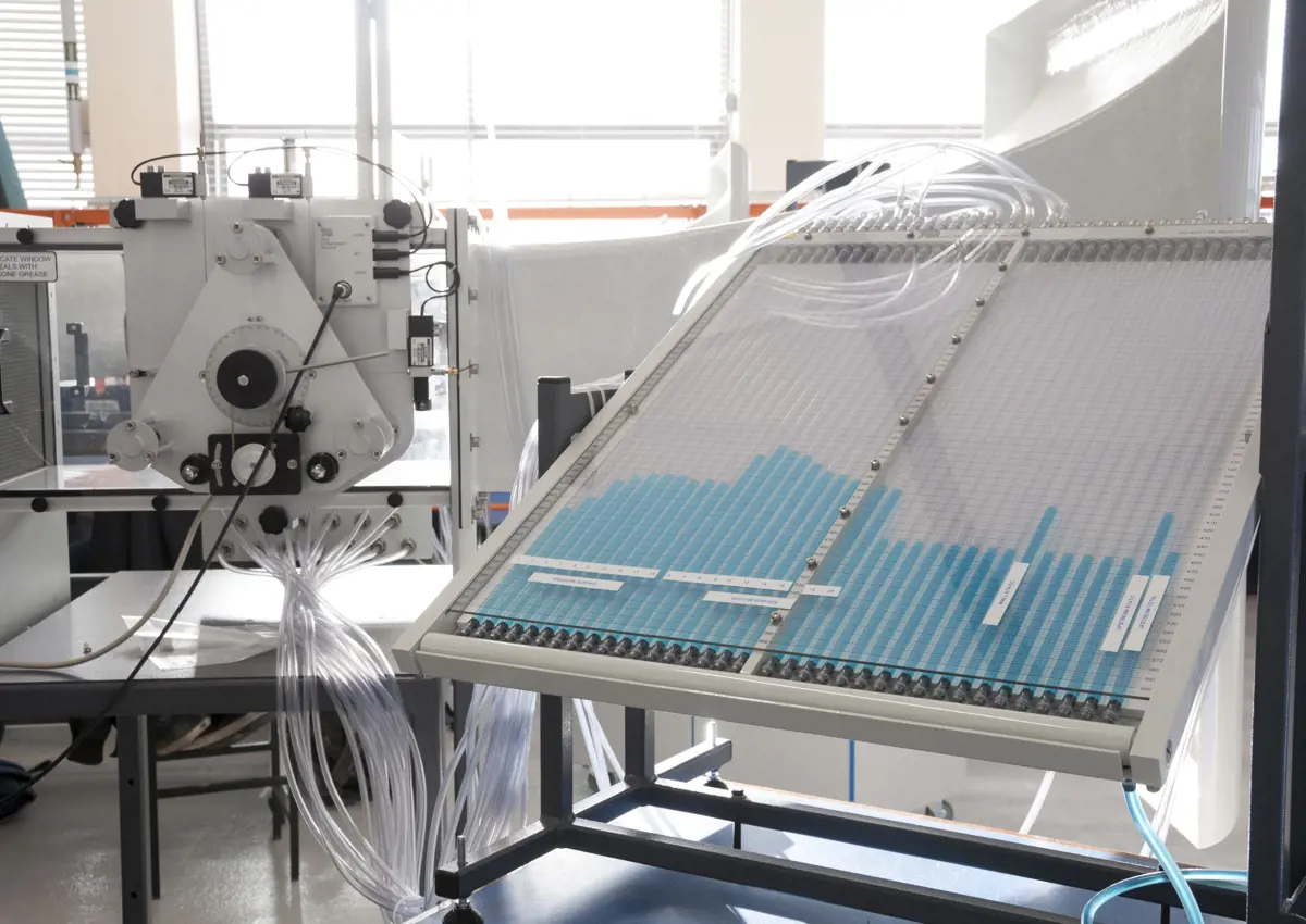 Large clear plastic machinery with several tubes