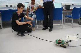 Students watching a robot navigate 