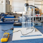 Lab equipment set up with hair dryer pointing at lab bench