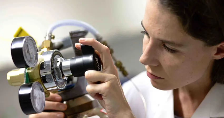 Professor Eleanor Stride with biomedical engineering equipment