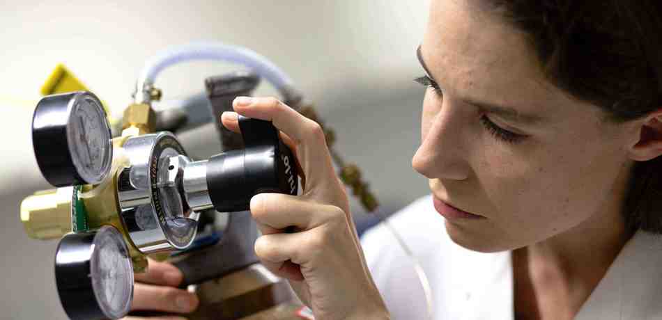 Professor Eleanor Stride with biomedical engineering equipment