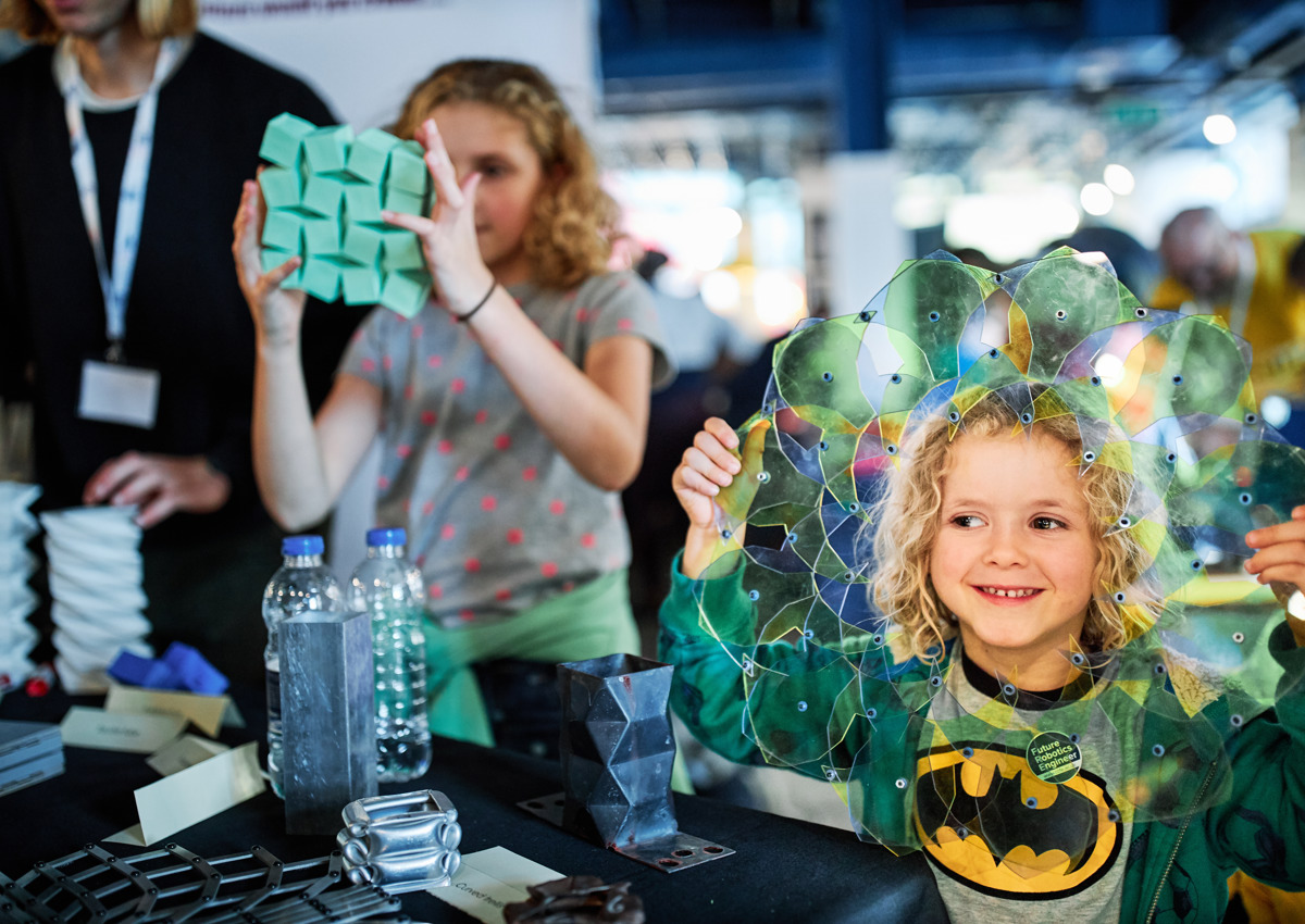 Kids learning about origami at Science Fair