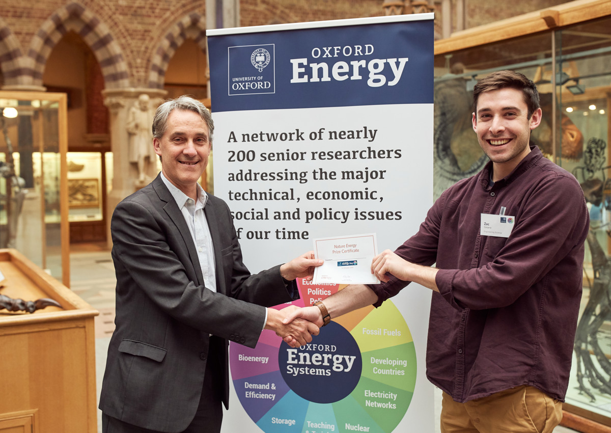 Zac Cesaro receiving his best poster award from Professor Nick Eyre at 8th annual Oxford Energy Day conference in 2019