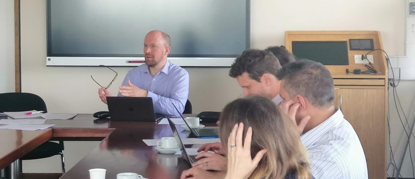 Professor Martin Booth chairs a meeting at Oxford's Engineering Science.