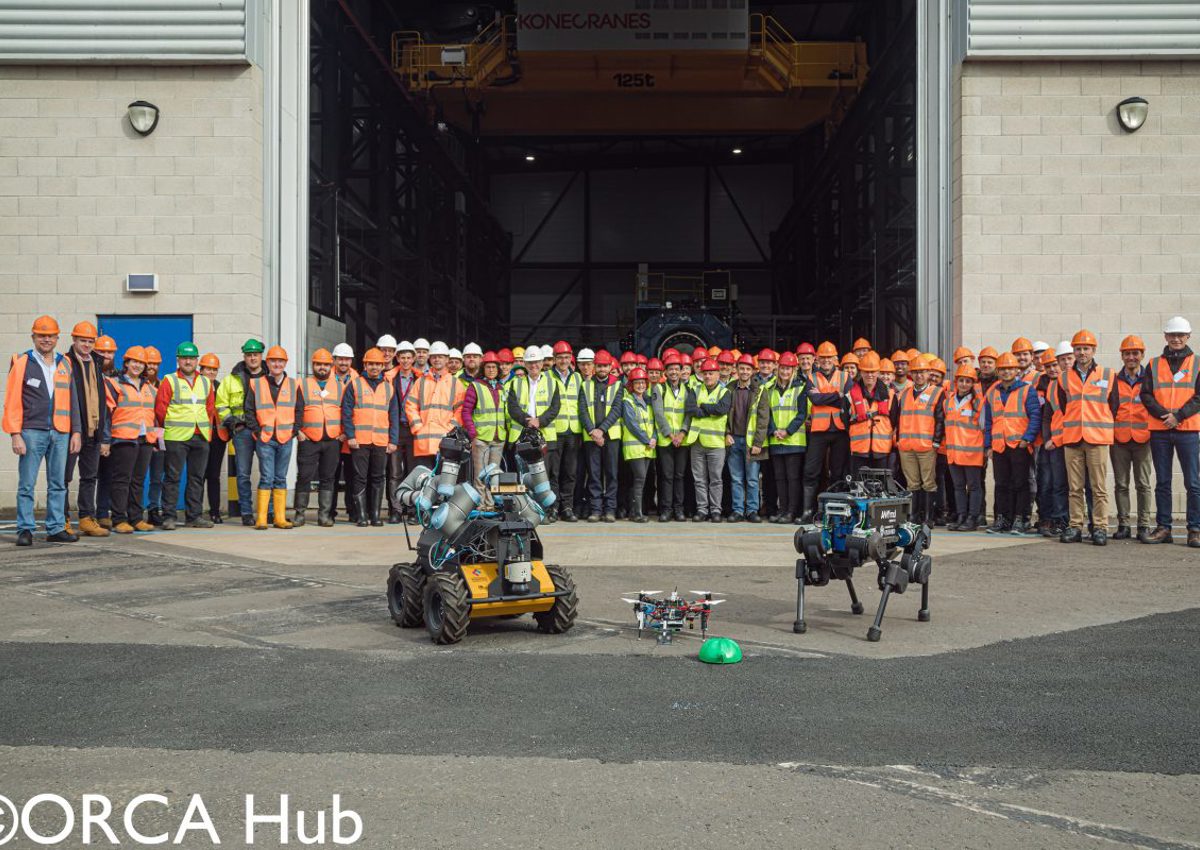 Researchers and industry representatives at the ORCA Hub demonstrations of legged robots