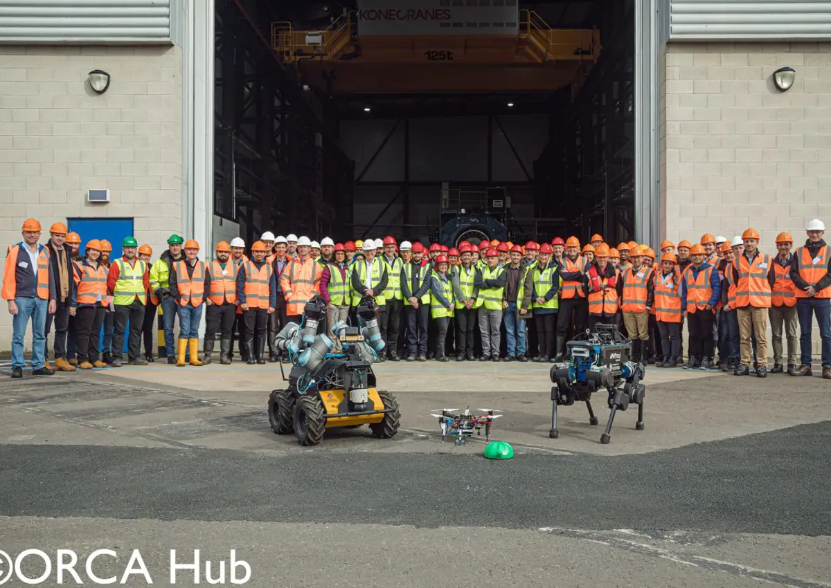 Researchers and industry representatives at the ORCA Hub demonstrations of legged robots