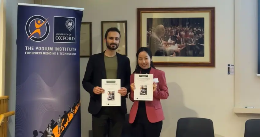 Konstantin Dzavaryan and Dr Chenying Liu holding awards from the Podium Institute Annual Conference on Sports Medicine & Technology 2025. Photo: Chenying Liu.
