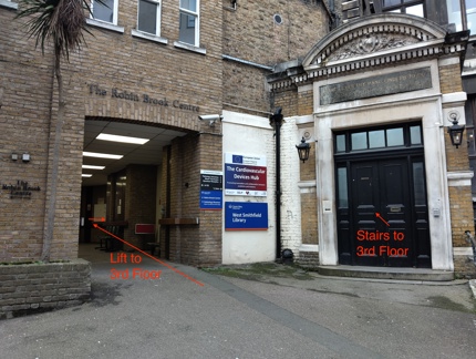 Image showing postion of lift through left entranceway, and stairs through black door to right of photo