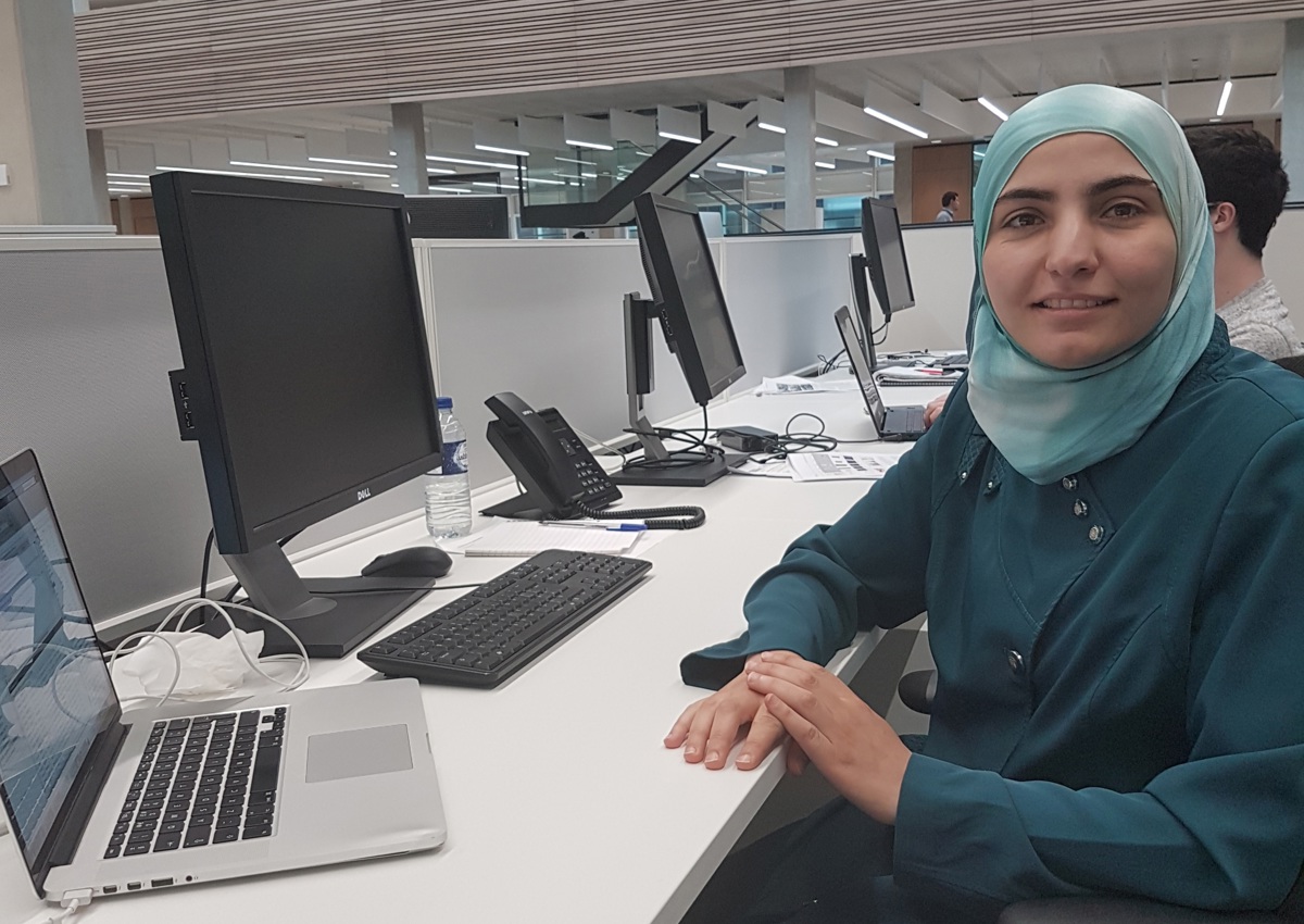 DPhil candidate Heba Sailem at her desk where she carried out research developing AI approaches to identify genetic factors that regulate the organisation of cells