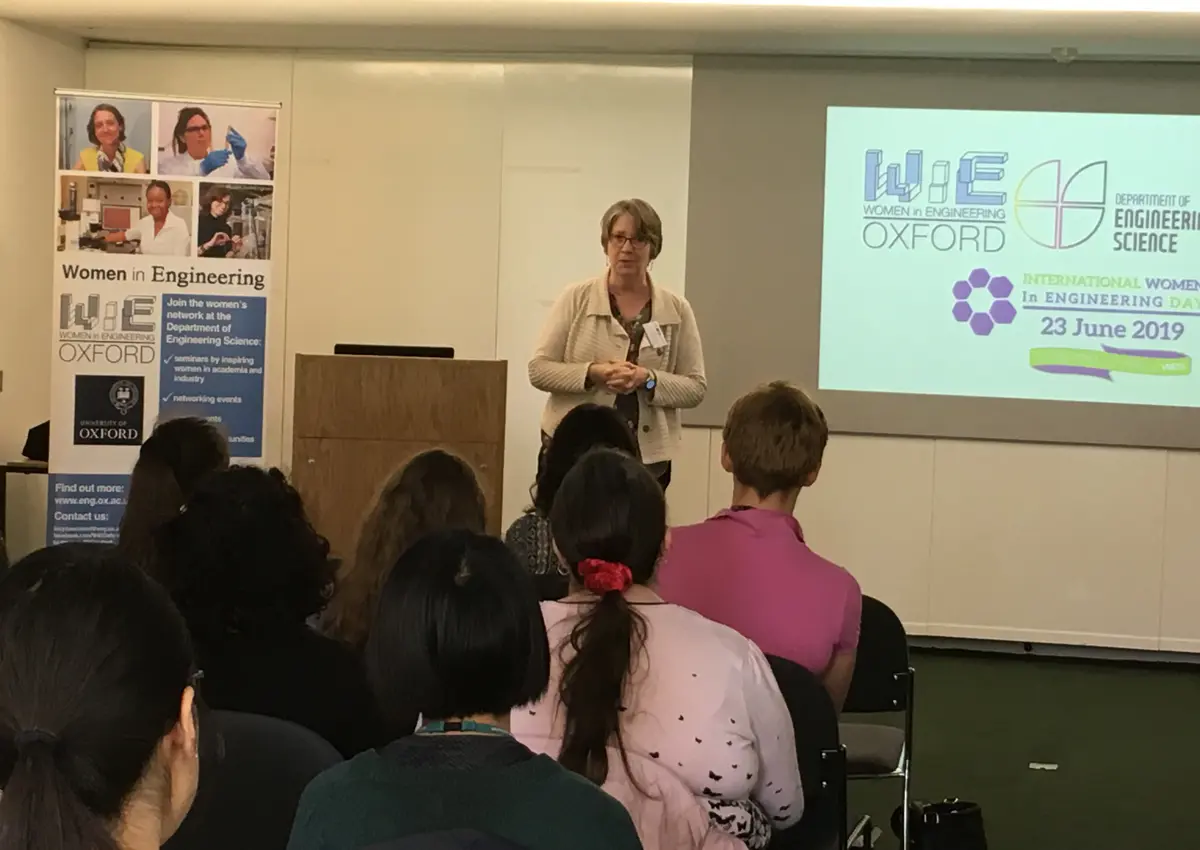 Adult giving a presentation to students