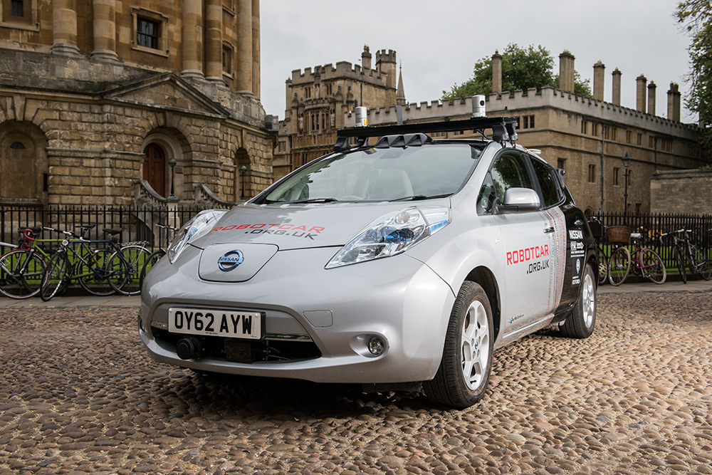 Robot car parked in front of the Radcliffe Camera. 