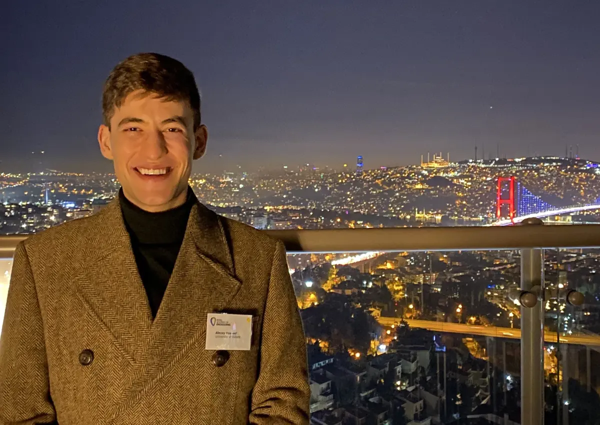 Alexy Youssef at night against city backdrop