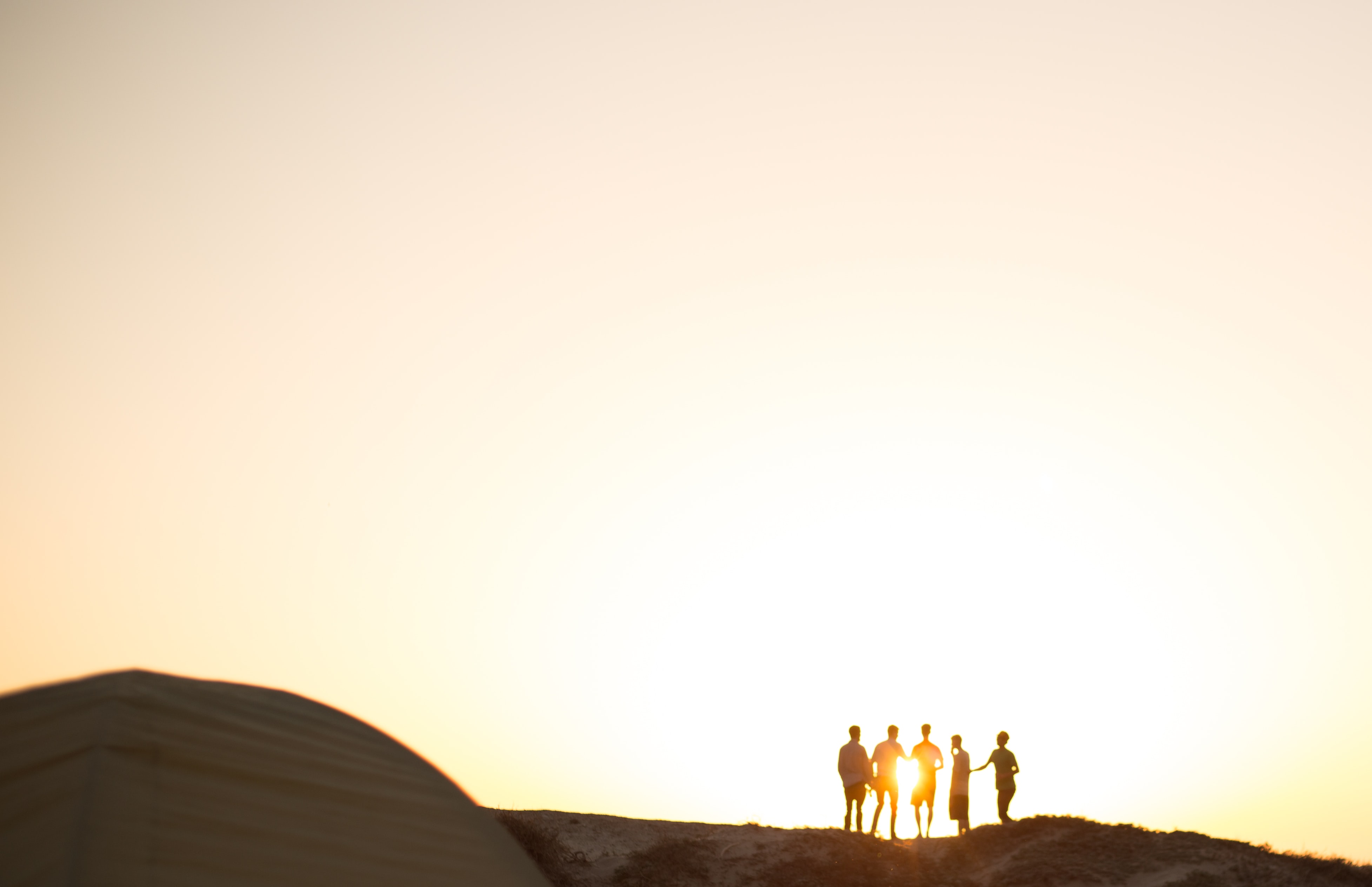 Stock image of group of people against light sky