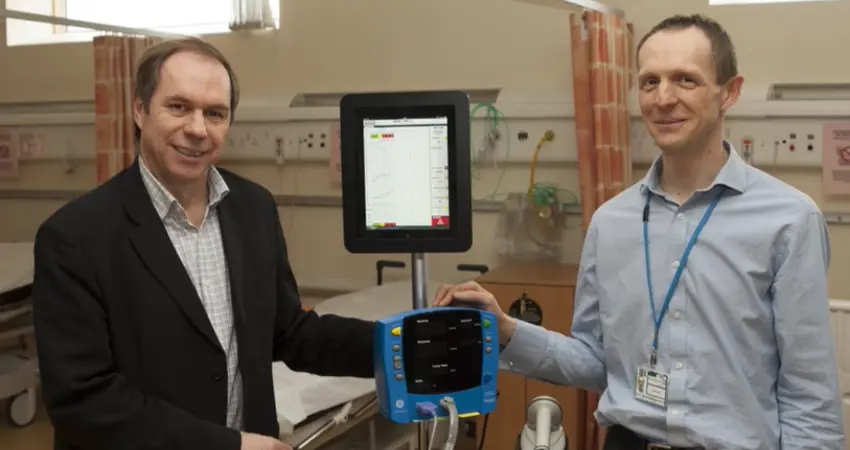 Lionel Tarassenko with a colleague in a hospital ward