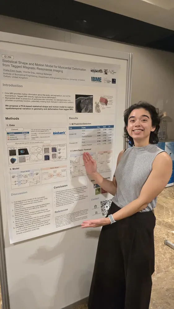 Thalia presenting a poster of her work