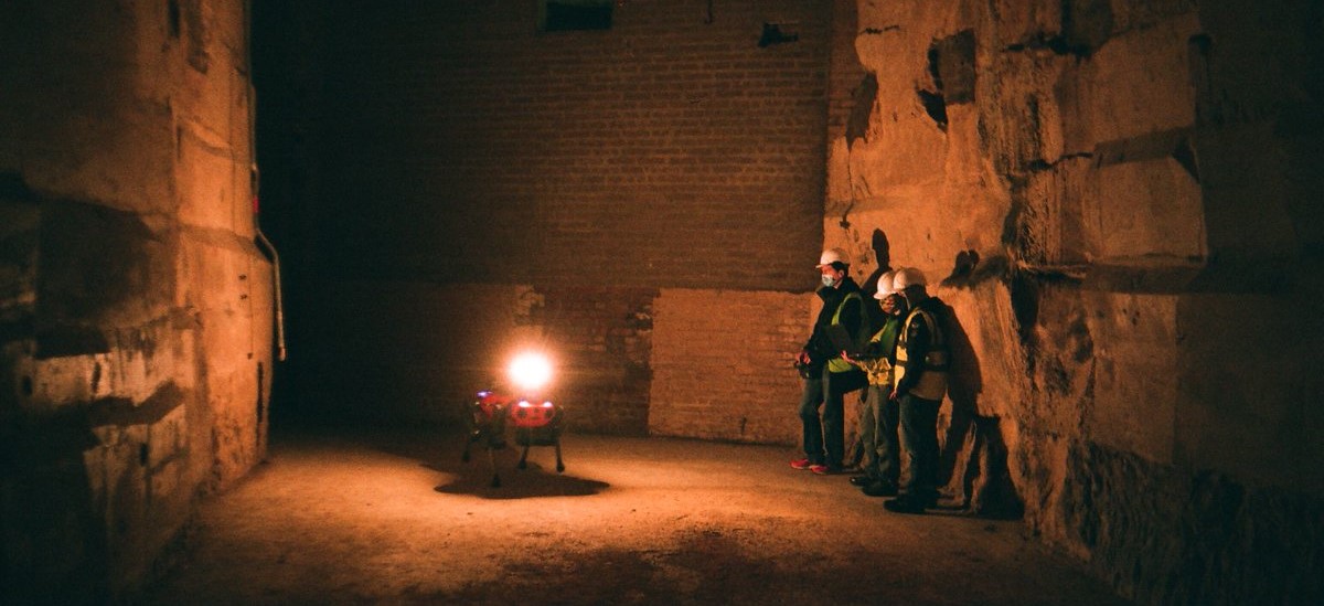 Robot and workers in a mine