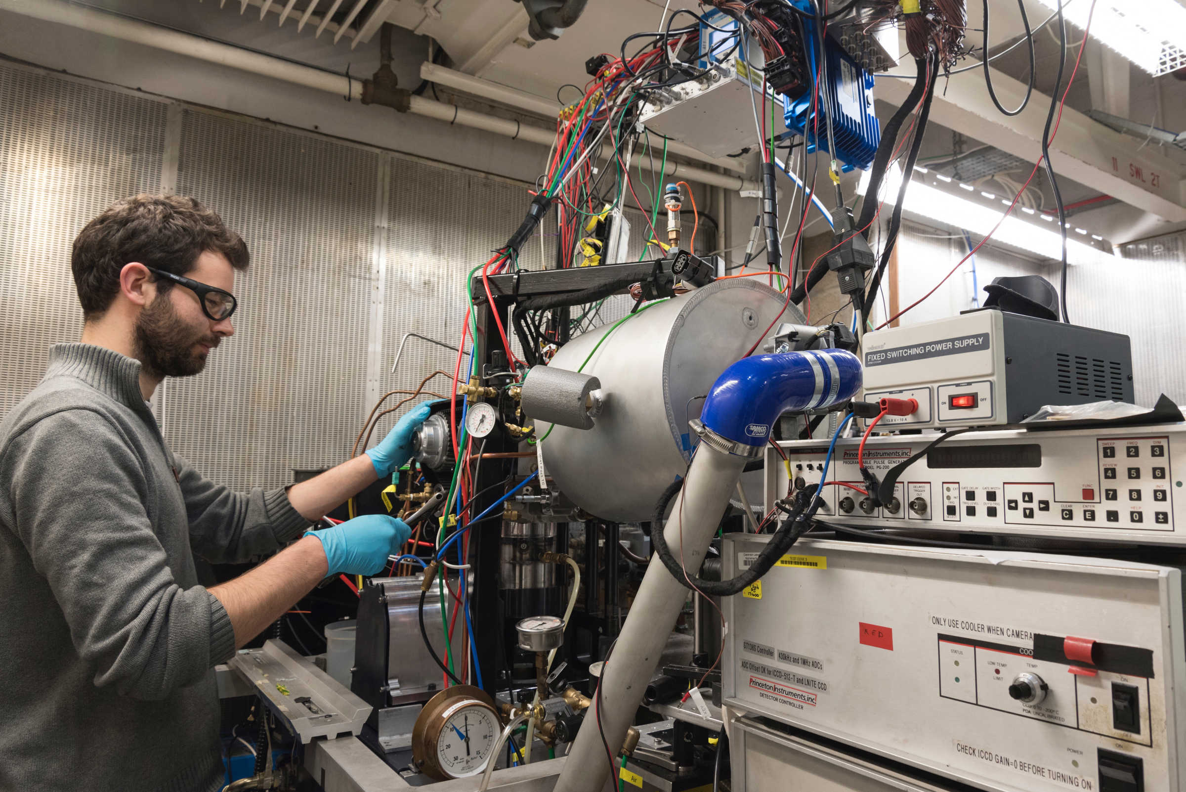 Researcher working on equipment in lab