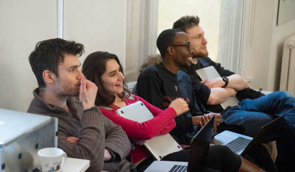 Researchers smiling for the camera during Robotics week