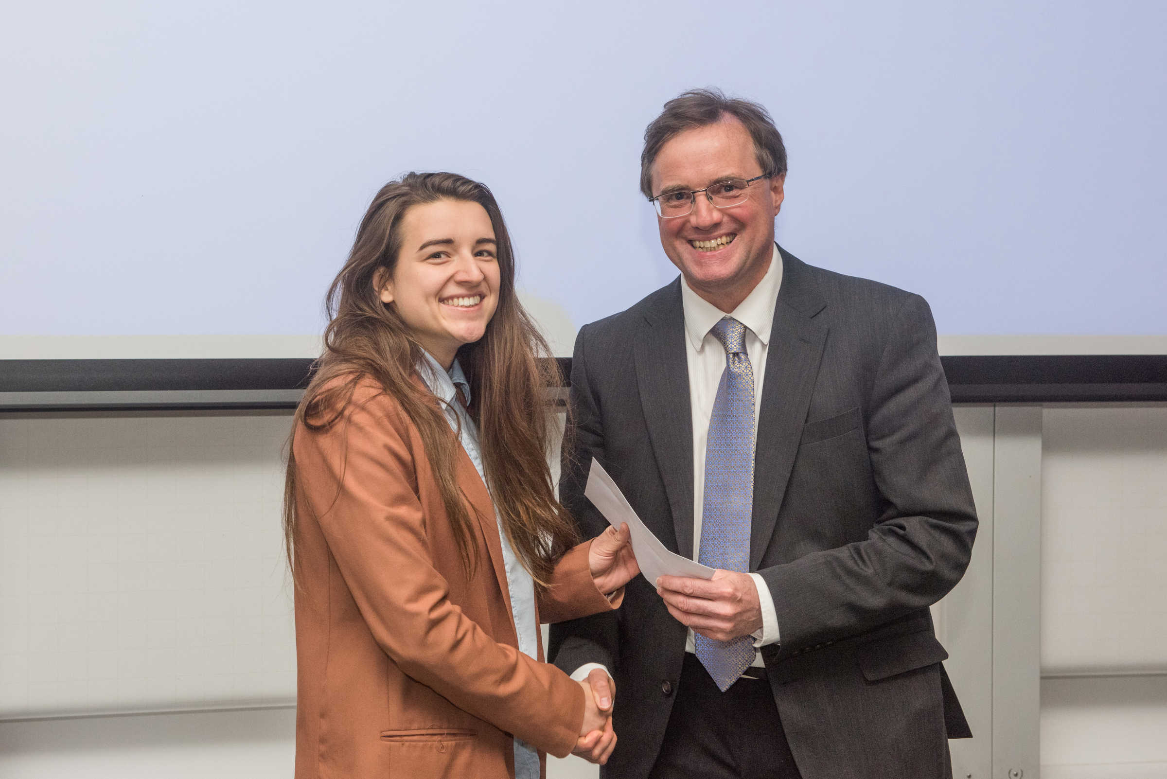 4th year student receiving her project poster prize at the lubbock lecture