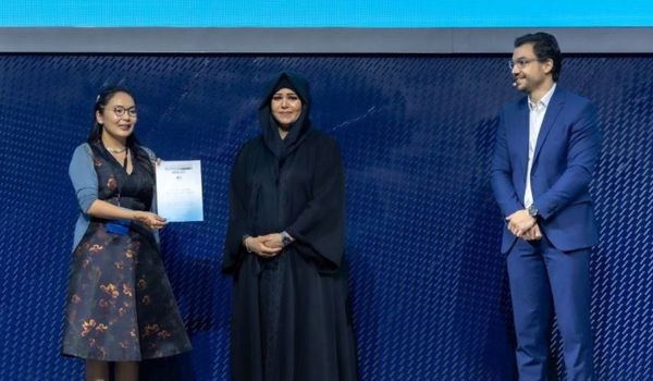 Maral Bayaraa: Maral, on the far left, receives an award on stage from the Dubai hosts, centre and right, at the COP28 Climate change conference.