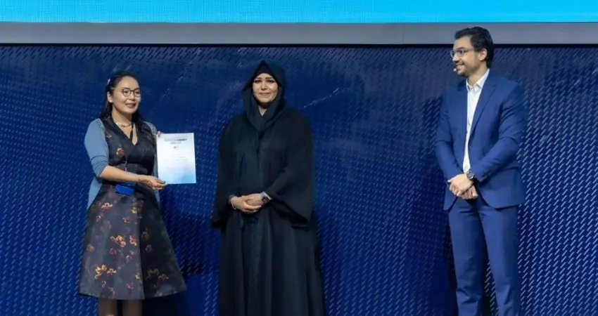 Maral Bayaraa: Maral, on the far left, receives an award on stage from the Dubai hosts, centre and right, at the COP28 Climate change conference.