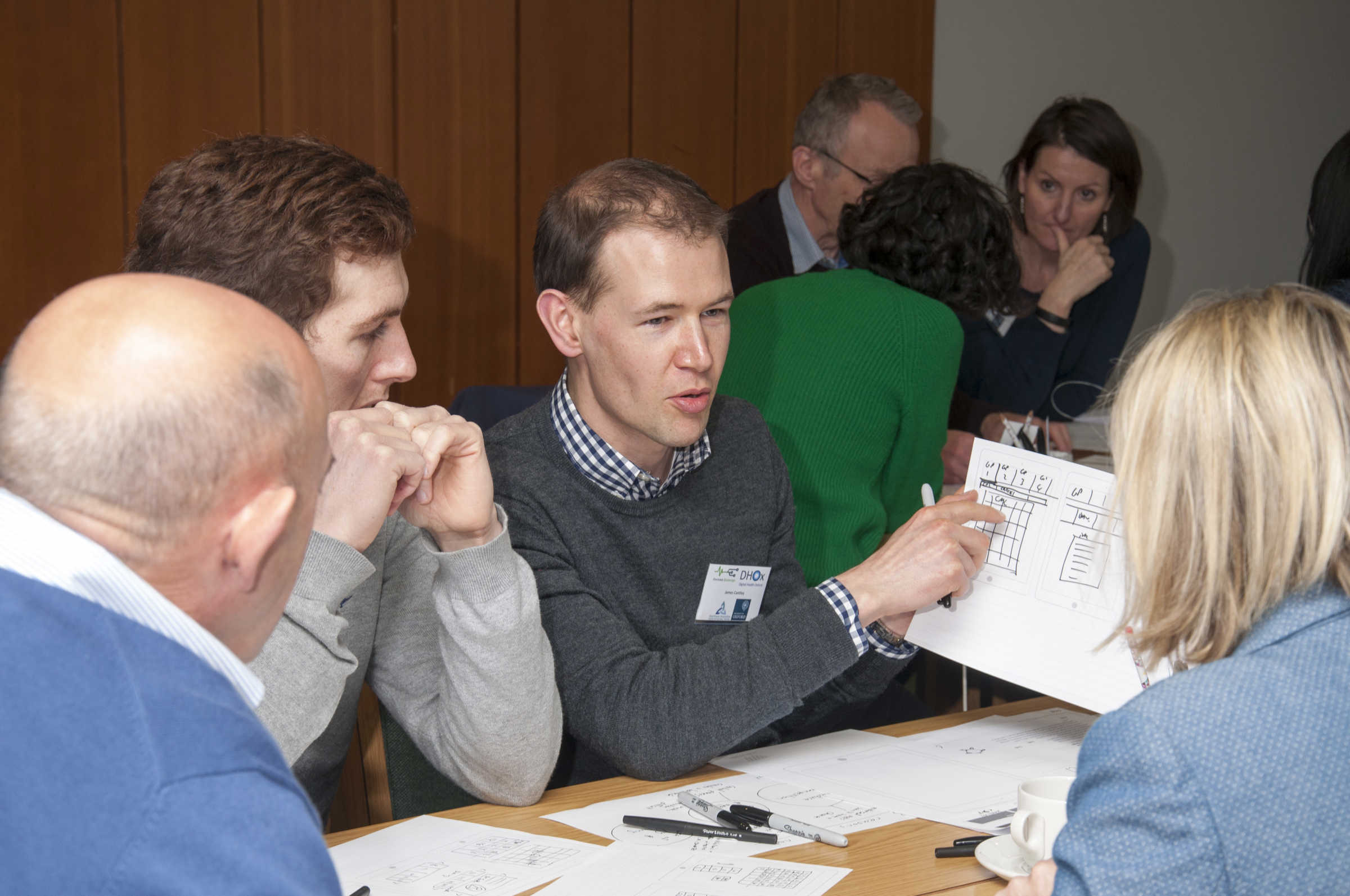 Academics discussing, at Digital Health Oxford conference