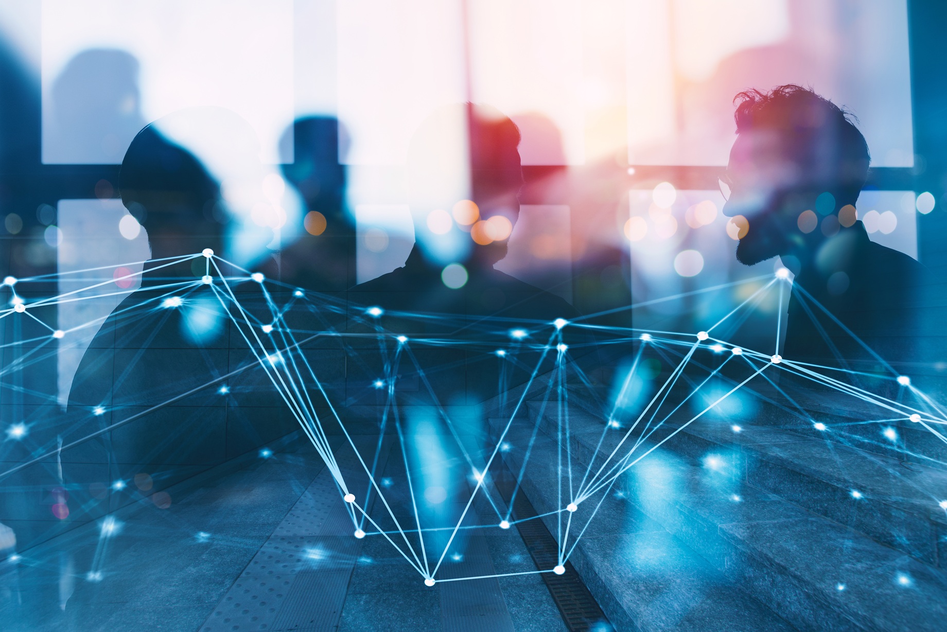 Stock image, abstract image showing head and shoulders of people behind technology visual