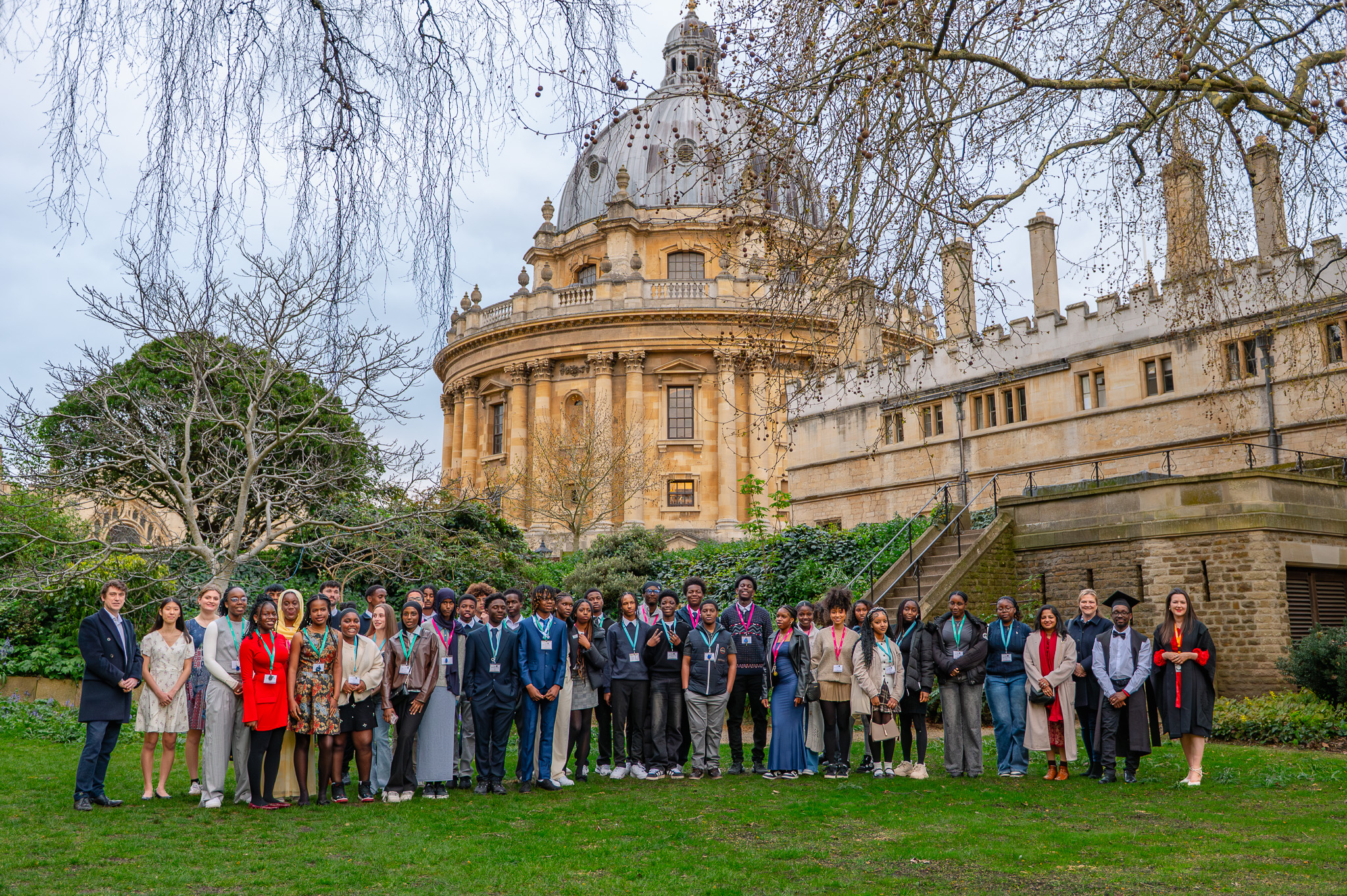 A large group of students pose for a photograph outside the Radcliffe Camera in Oxford during the Uncover Engineering residential programme.