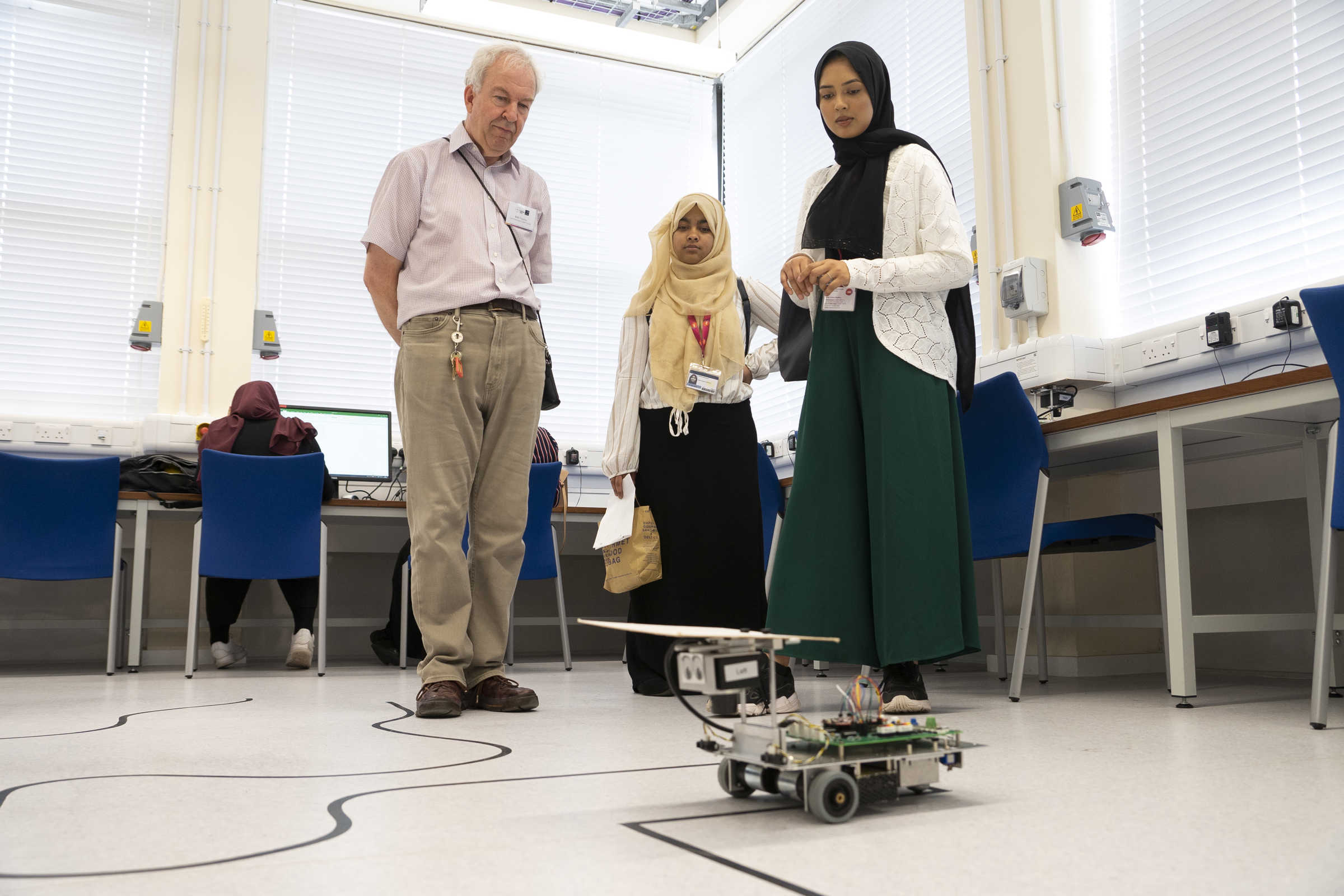 Participant of the UNIQ Summer School 2019 taking part in robotics line-following workshop, image by William Parry, Wadham College