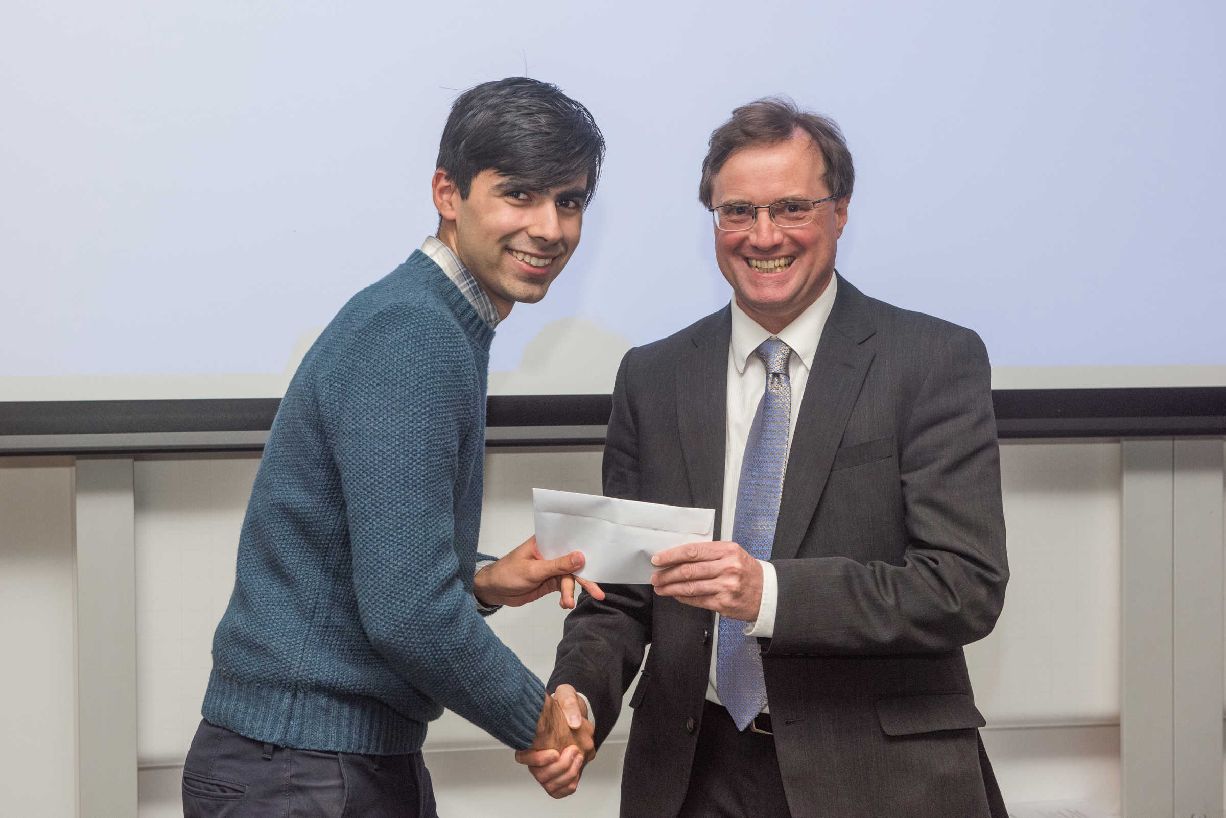 4th year student receiving his project poster prize at the lubbock lecture