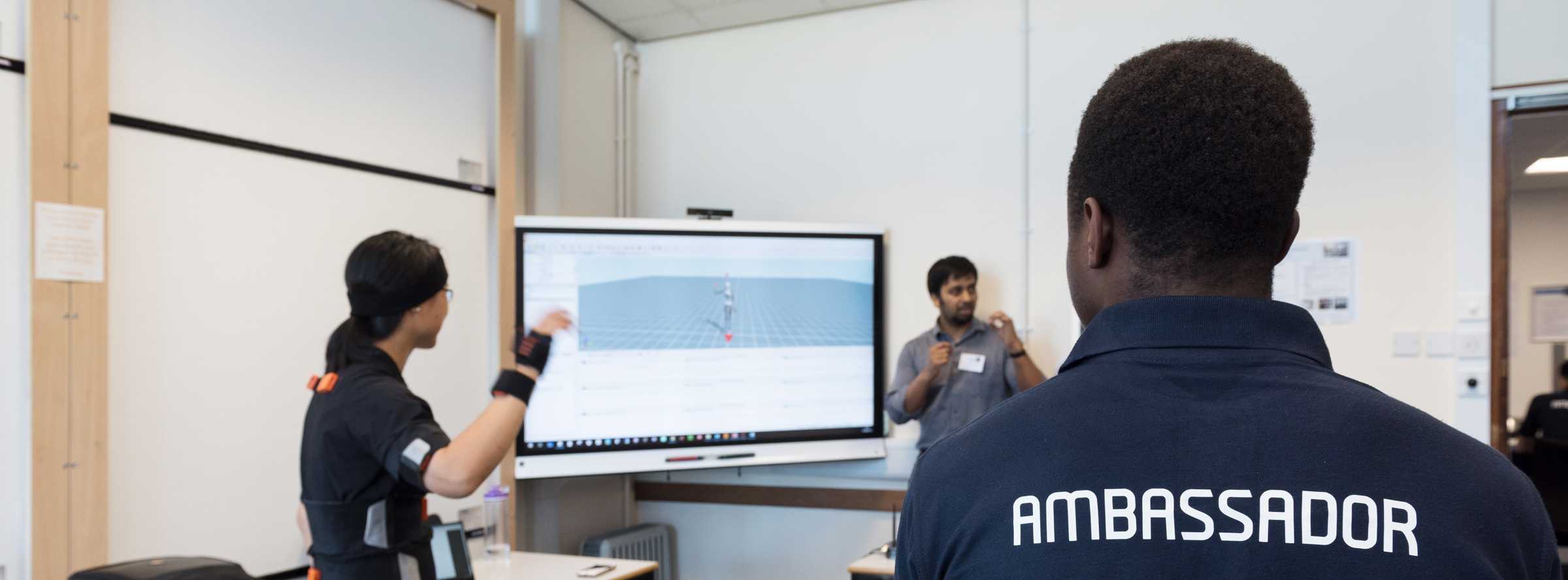 Student watching motion sensor demo