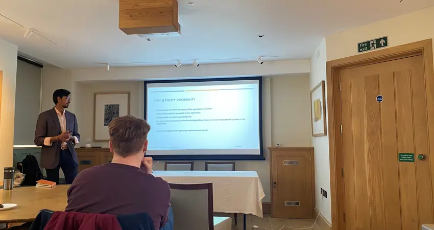 Post-Doctoral Researcher, Dr. Veerle Brans, organises series of policy learning events. Image shows speaker, Mihir Sheth, explaining the importance of policy for researchers.