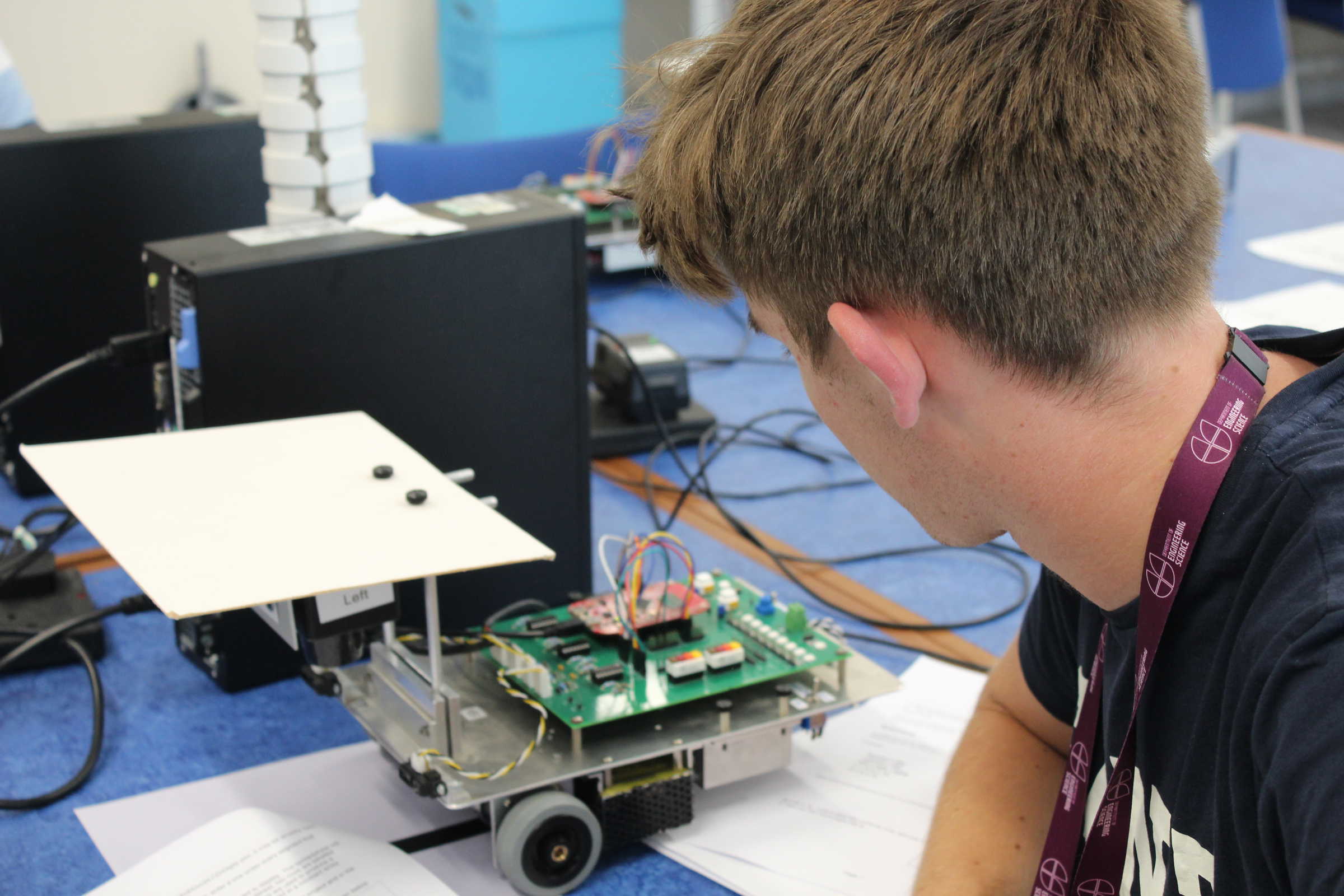 Student looking at robot