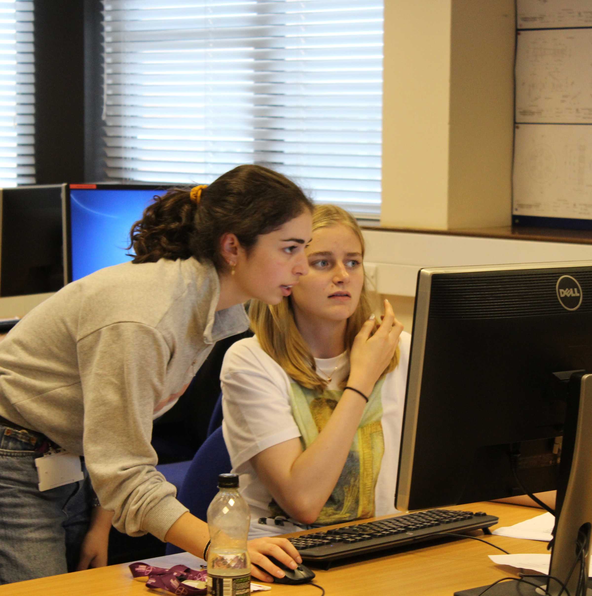 two students looking at a computer