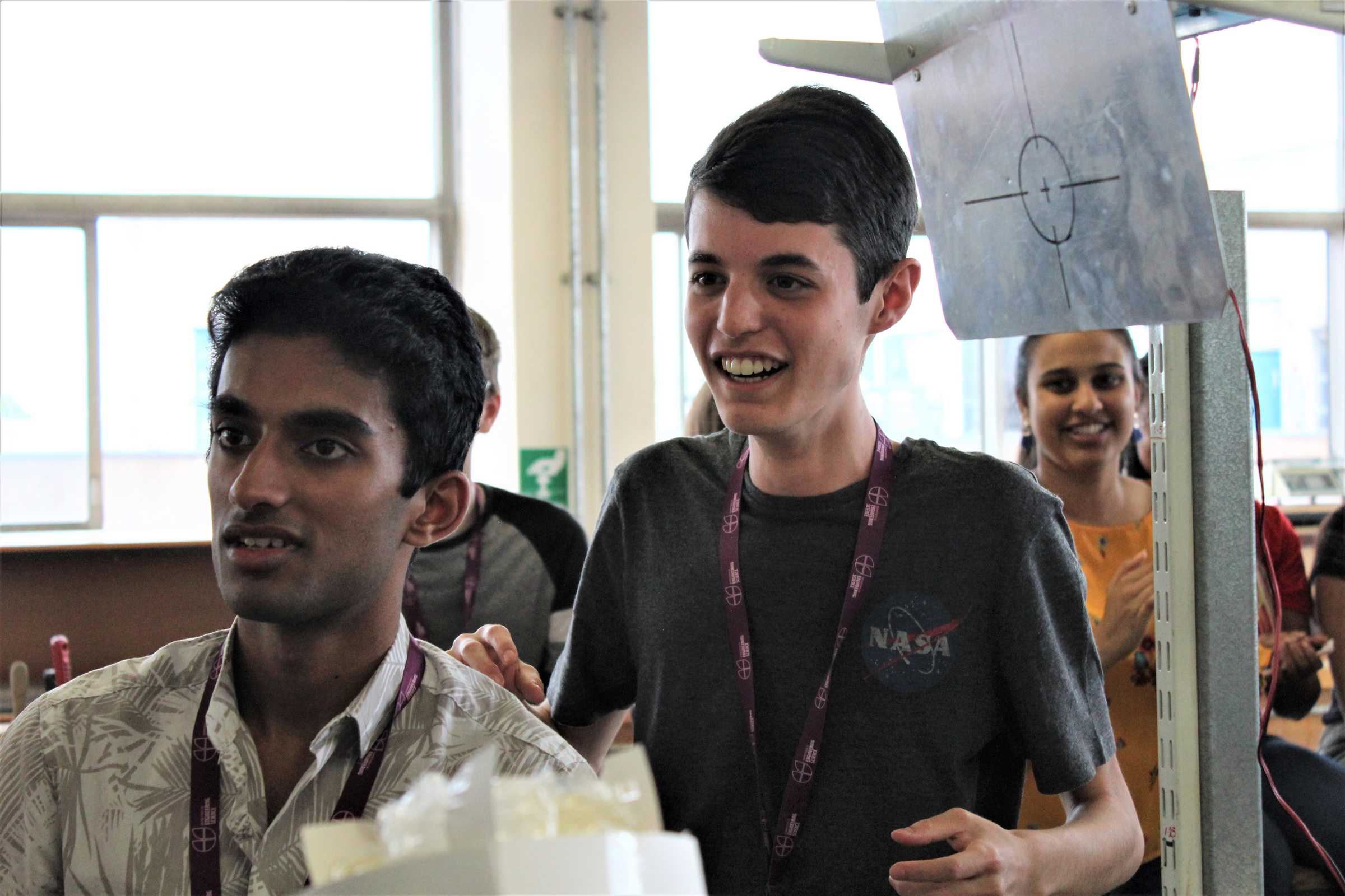 Excited school students in workshop 