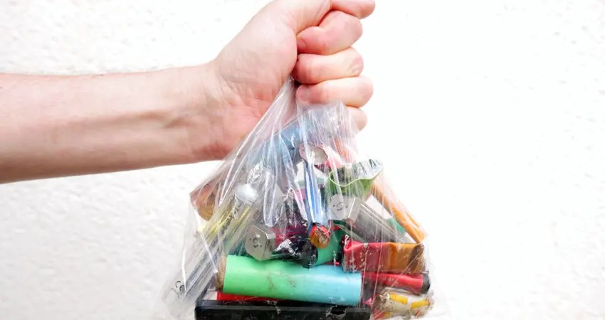 Discarded e-cigarette batteries in plastic bag