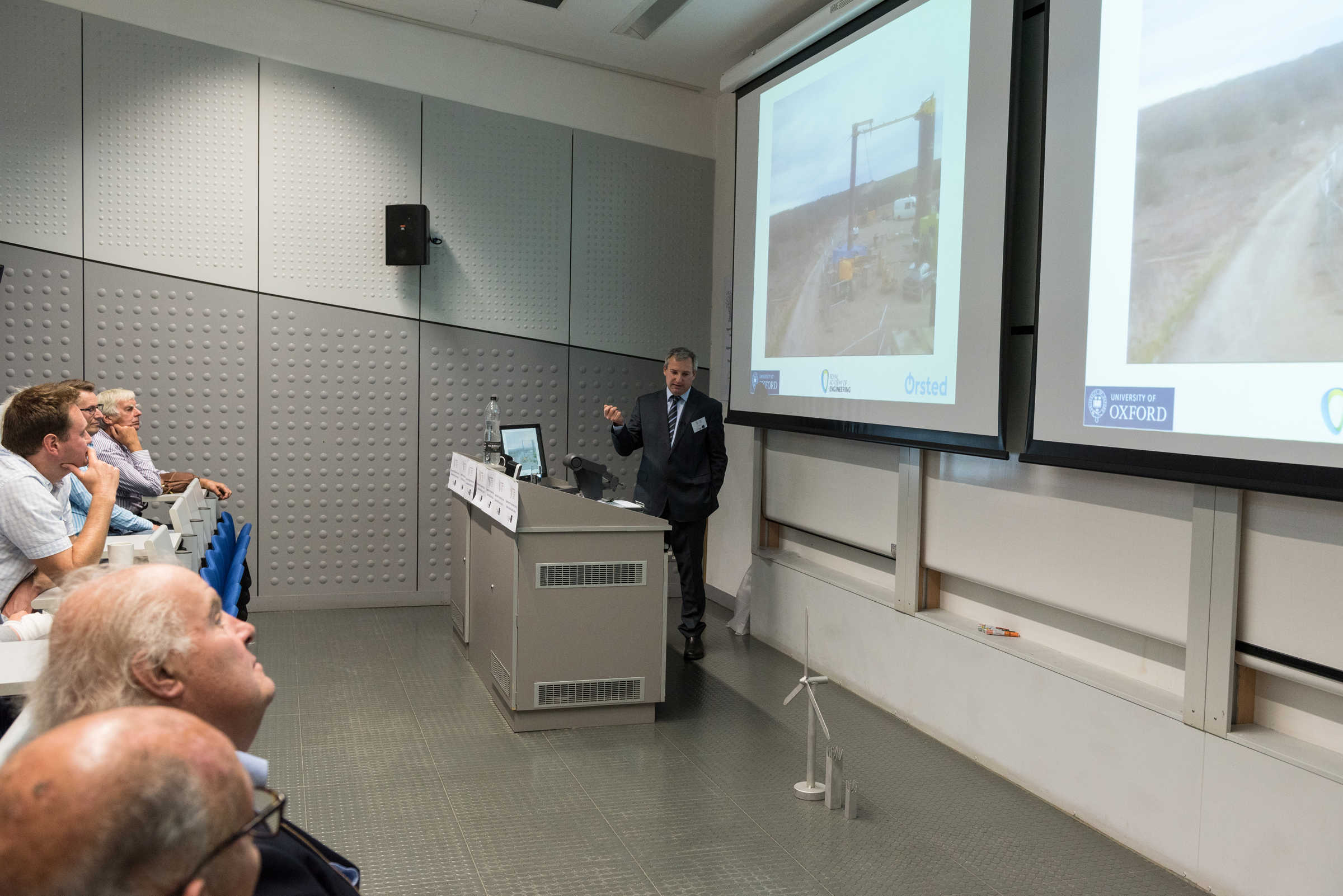 Alumni in lecture theatre listening to talk by Professor Byron Byrne