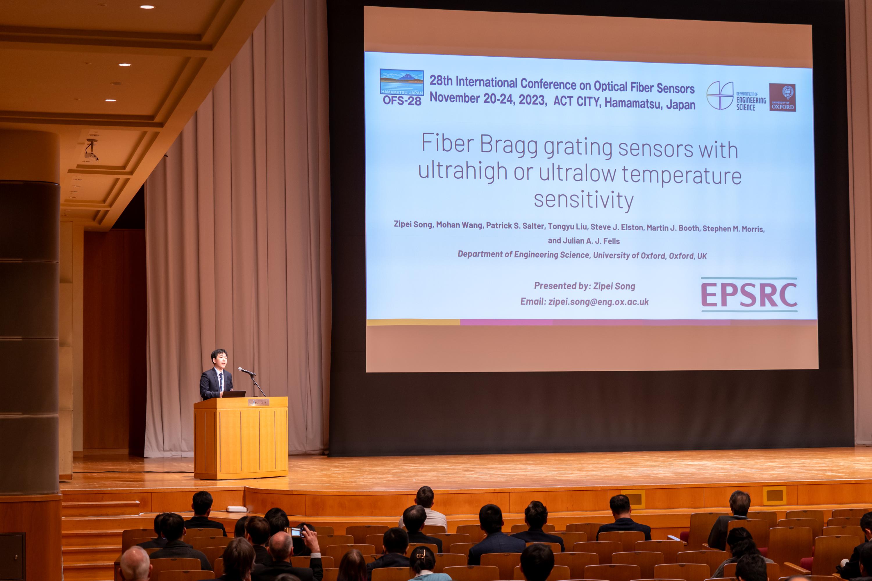 Zipei Song presenting at the 28th International Conference on Optical Fiber Sensors in Hamamatsu, Japan