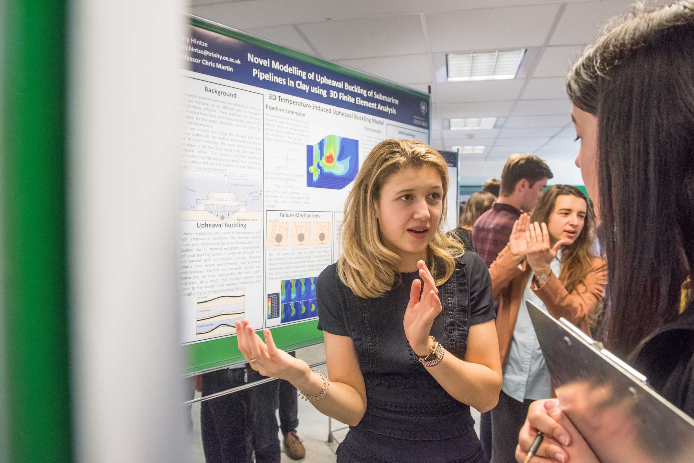 Participants discussing posters during the Engineering Lubbock Lecture