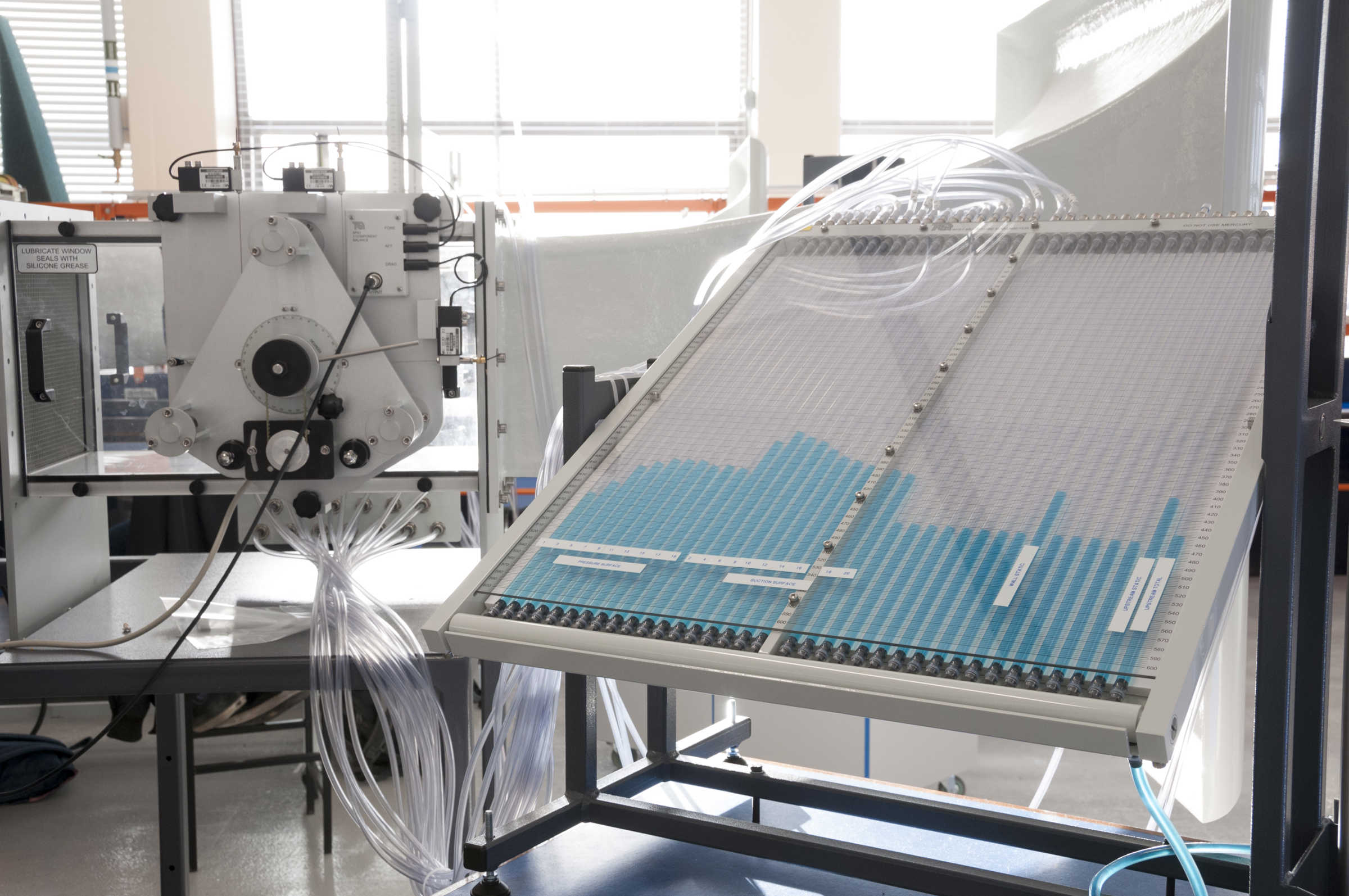 Large clear plastic machinery with several tubes