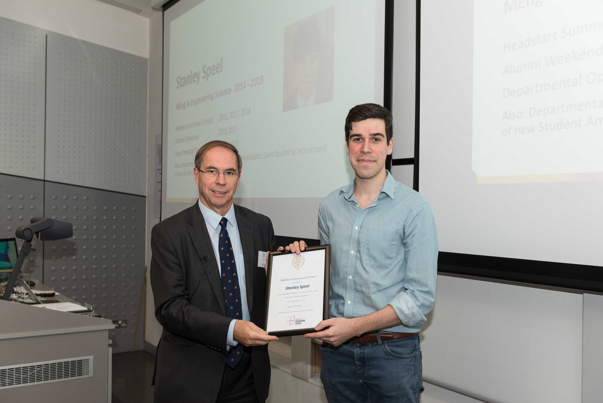 DPhil student recieves Matthew Greenwood award, from head of the department in 2018 Prof Lionel Tarassenko