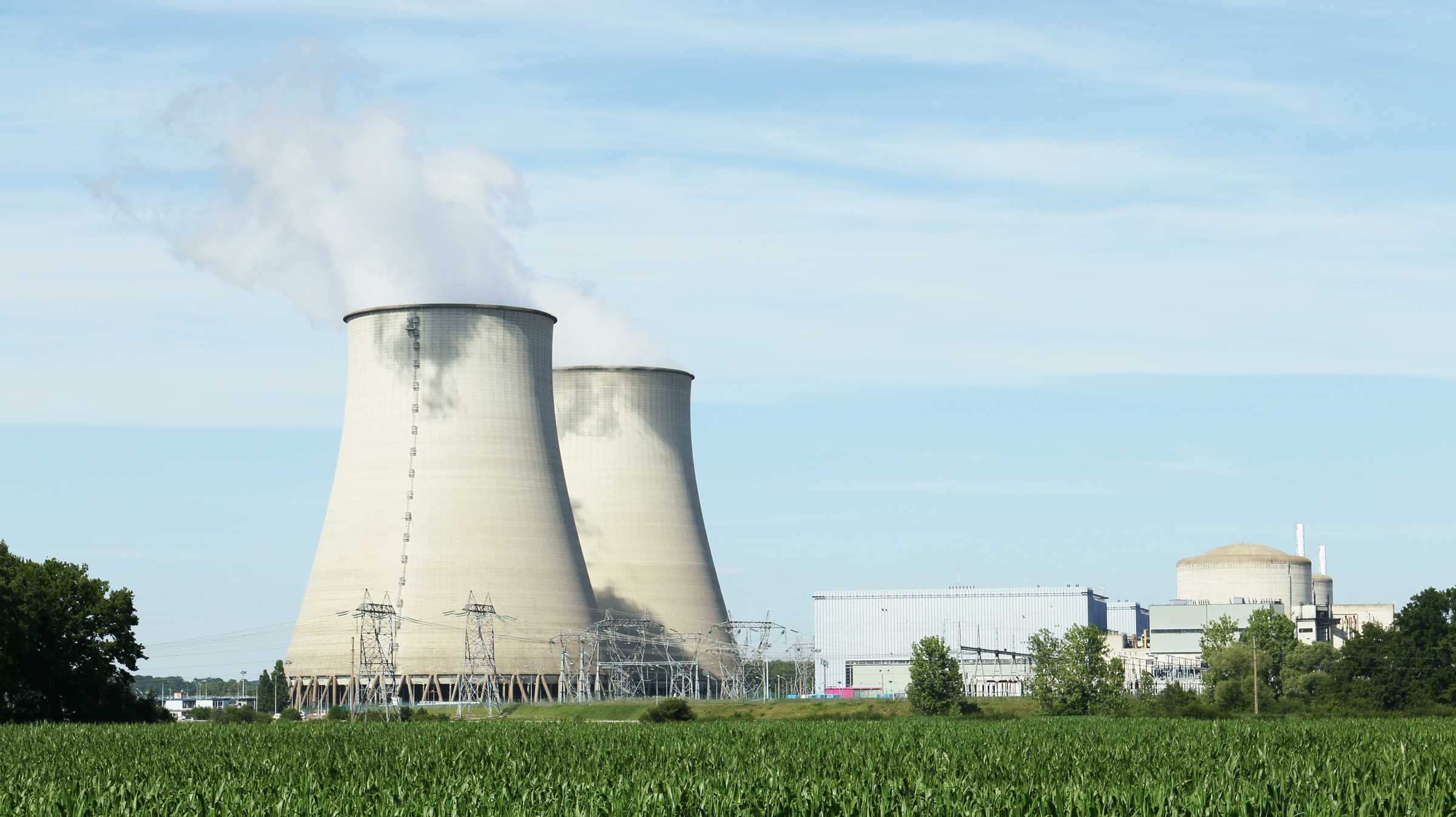 Big cooling towers in a factory in the countryside