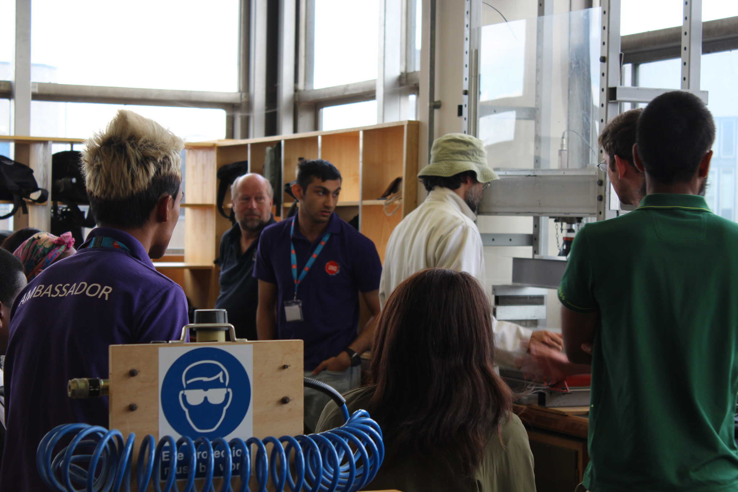 Demonstration of equipment in lab to school students during outreach programme