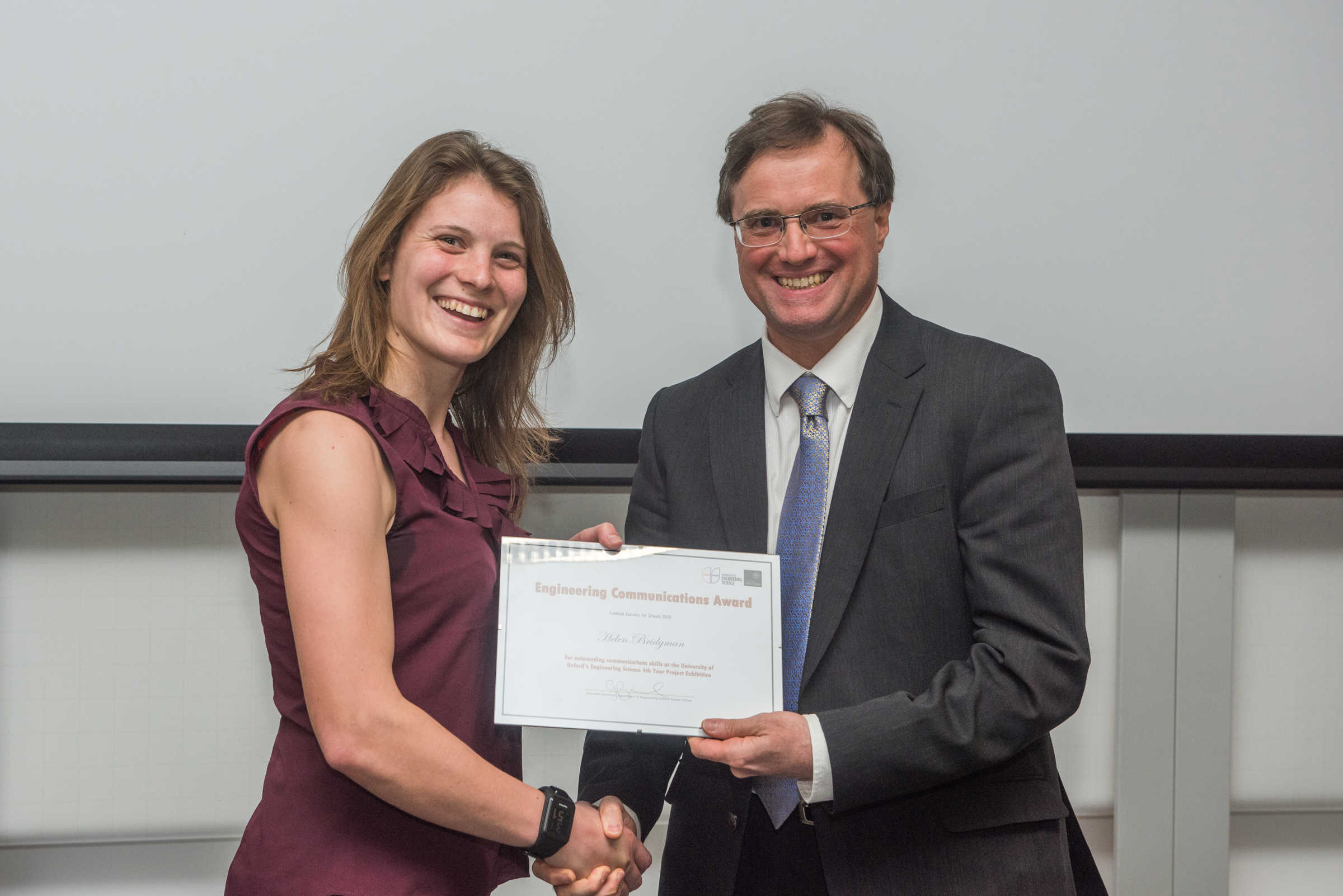 4th year student receiving her project poster prize at the lubbock lecture