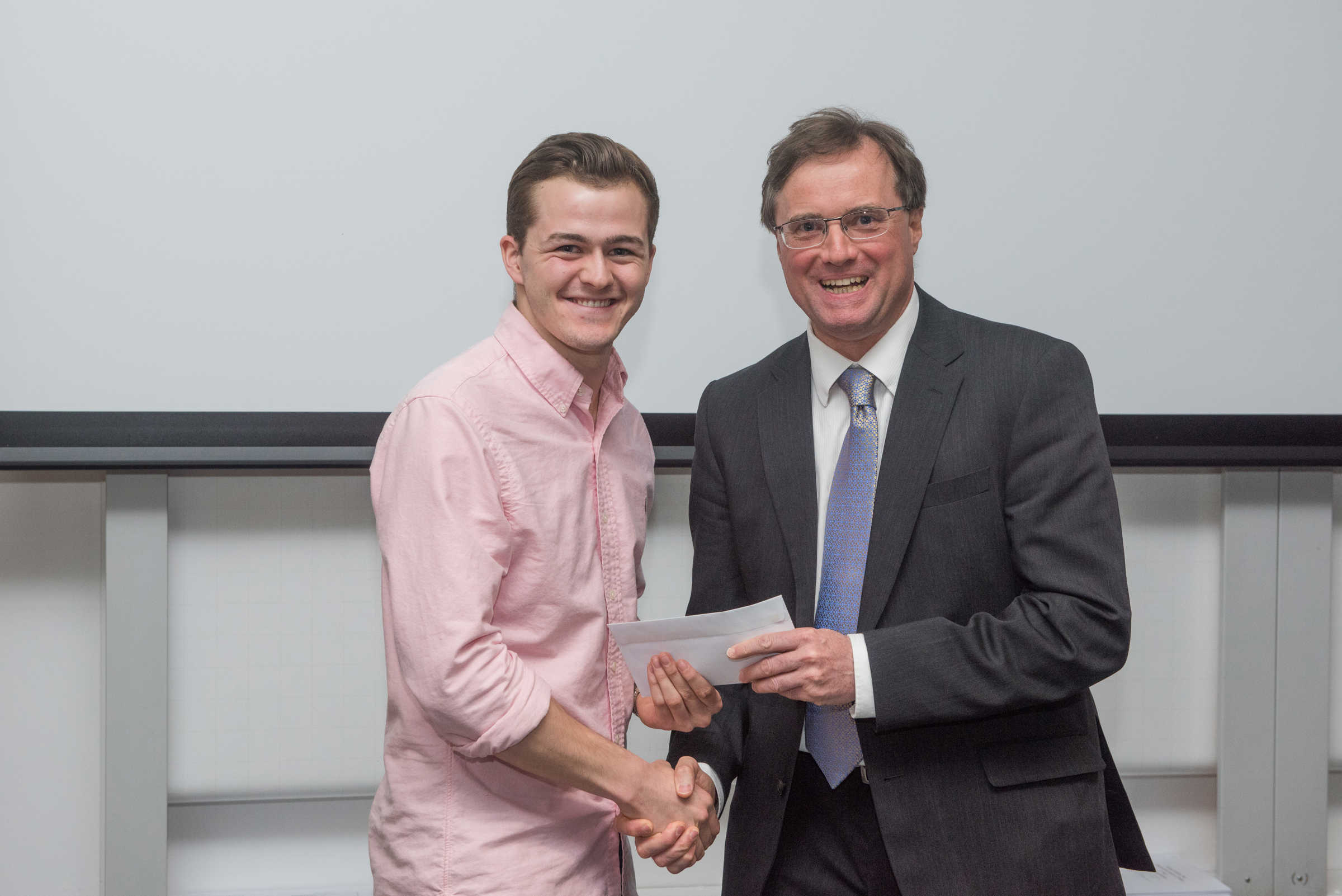 4th year student receiving their project poster prize at the lubbock lecture