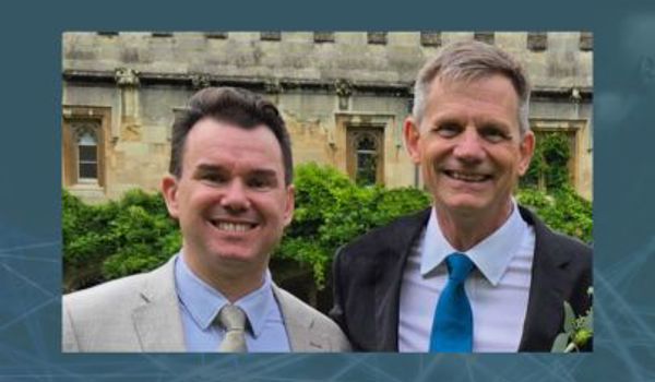 Professor Constantin Coussios and Professor Robin Cleveland smiling outdoors in front of an Oxford college building.