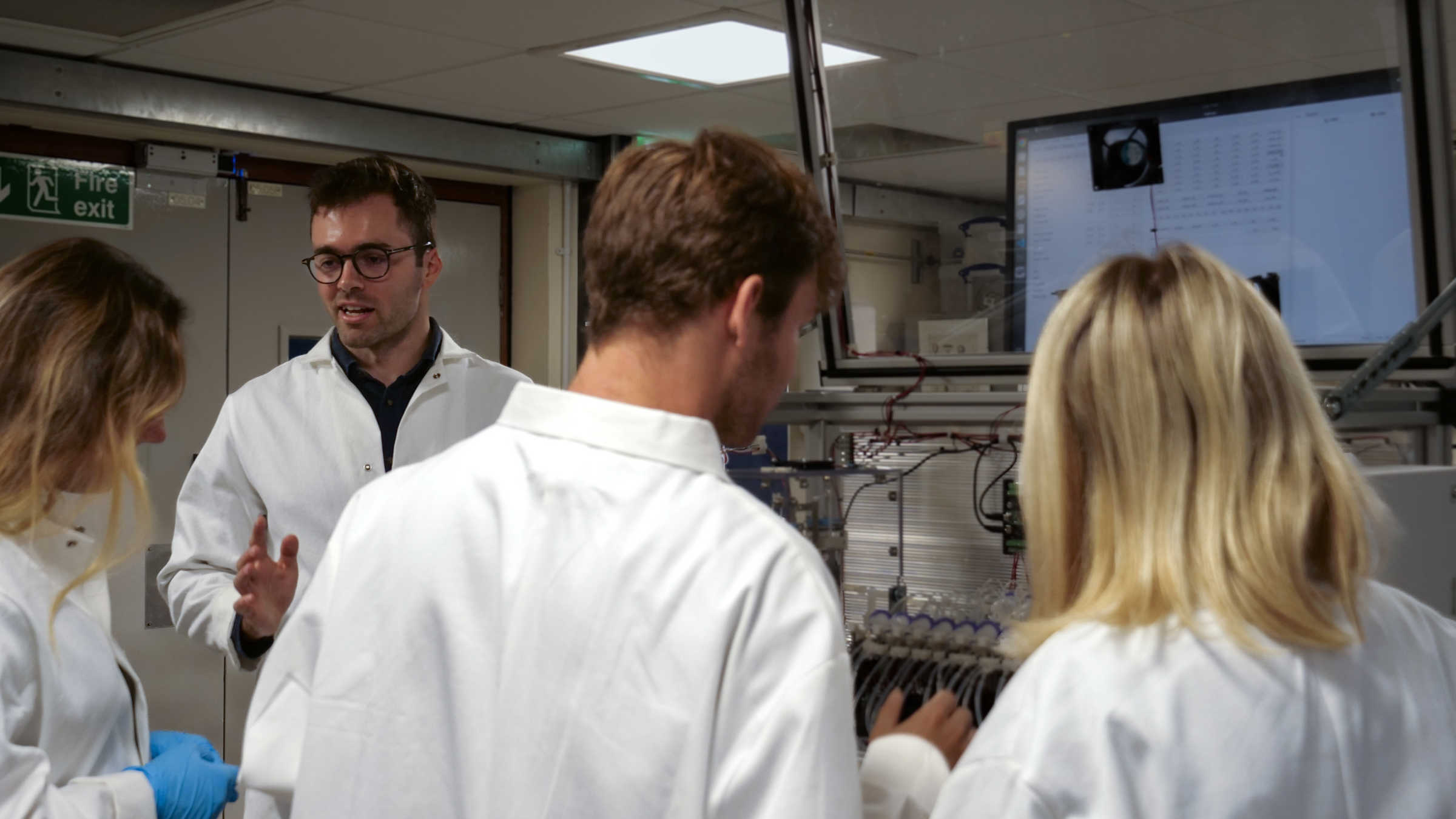 Professor Harrison Steel in his lab, working with students on their research.