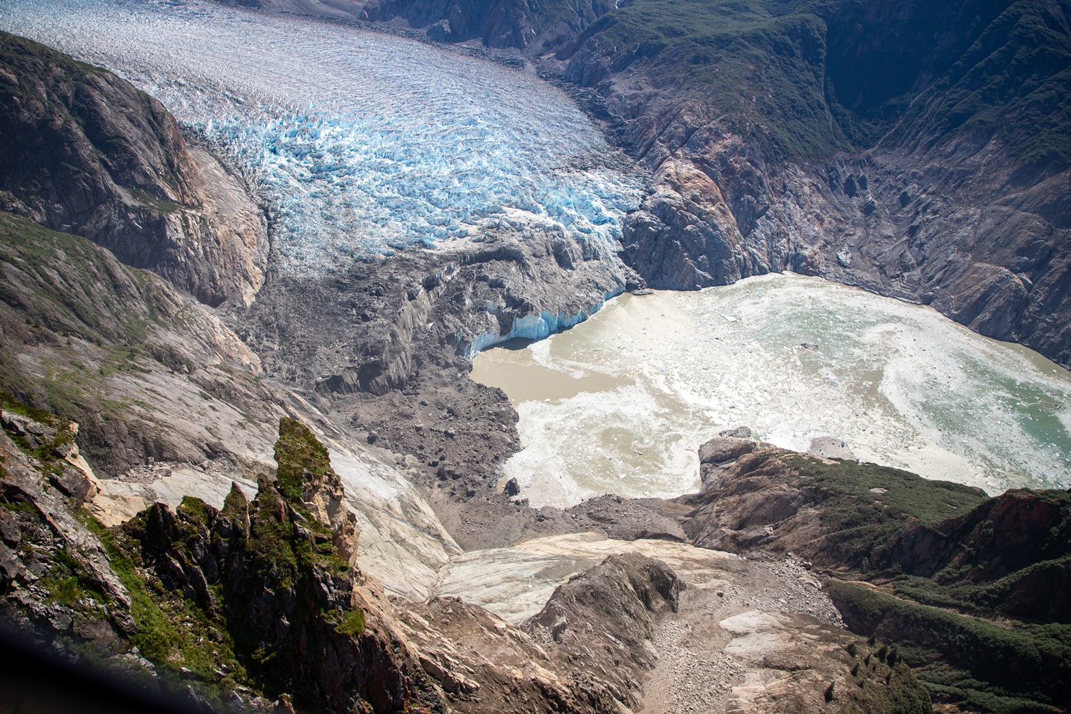 View of the landslide zone around the South Sawyer Glacier that triggered the megatsunami in Tracy Arm fjord. This photo was taken during a U.S. Geological Survey field reconnaissance flight on August 13, 2025. Credit: John Lyons/U.S. Geological Survey.