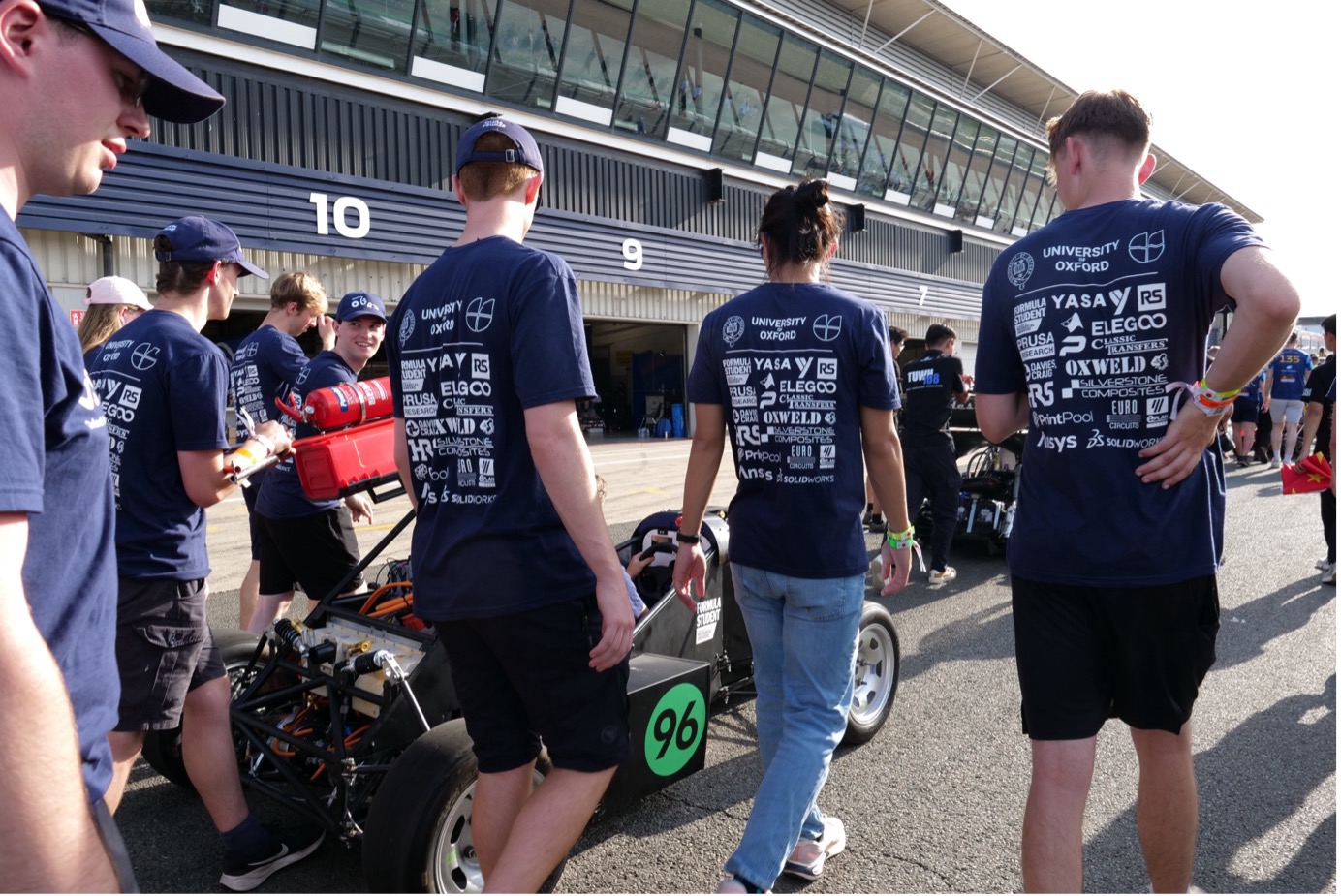 Team placing the car on the race track