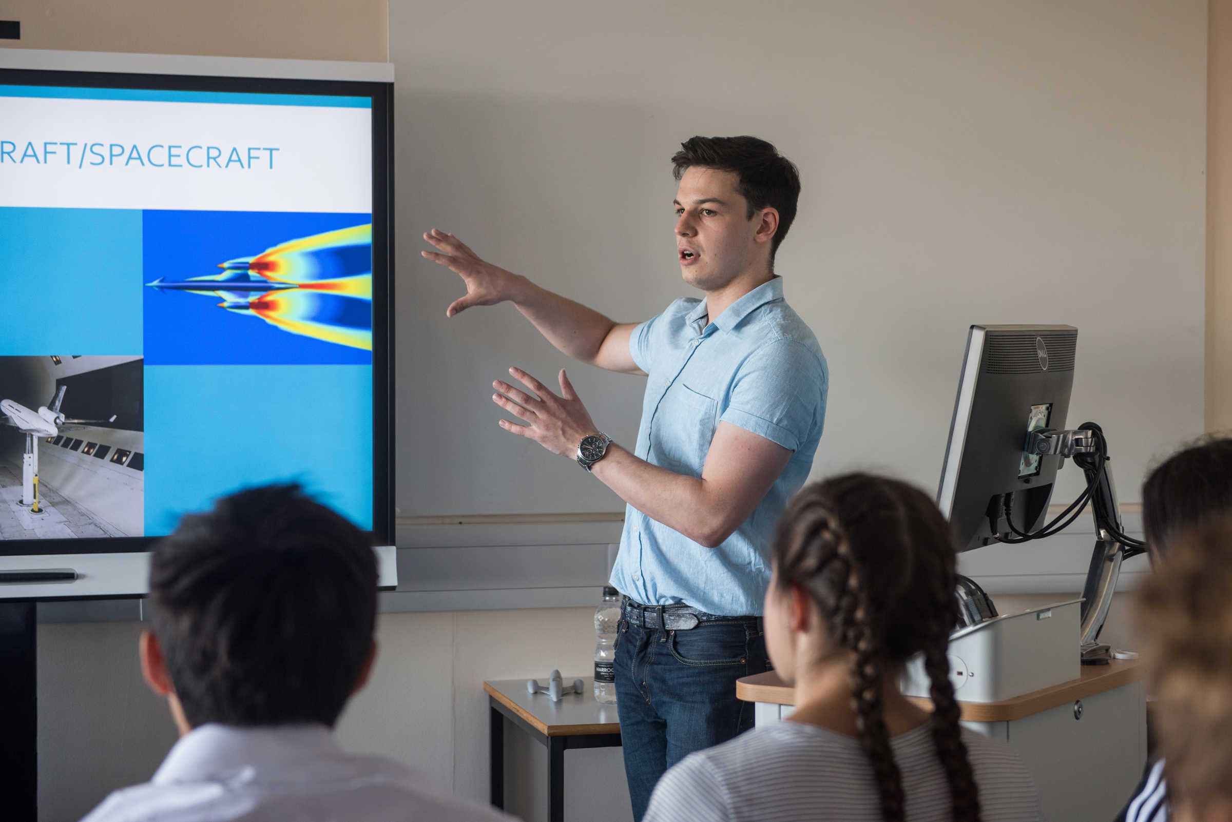 Student giving presentation on spacecraft